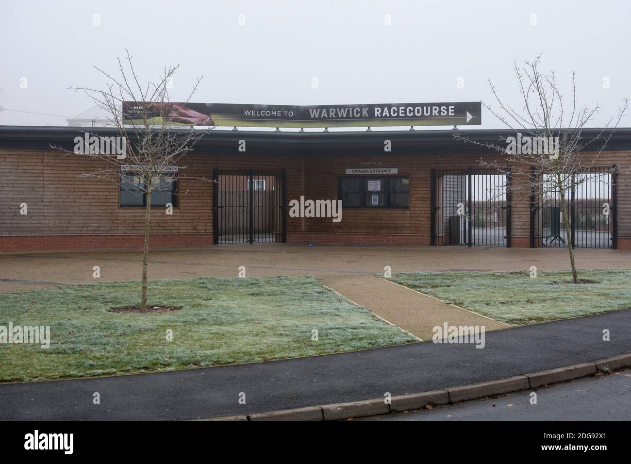 The entrance to Warwick Racecourse on a foggy winter`s day, Warwickshire, UK Stock Photo